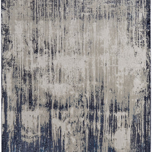 4' X 6' Tan Blue And Ivory Abstract Power Loom Distressed Area Rug