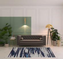 4' X 6' Ivory Blue And Gray Abstract Power Loom Distressed Area Rug