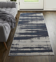 4' X 6' Ivory Blue And Gray Abstract Power Loom Distressed Area Rug