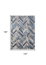 10' X 13' Ivory Blue And Gray Chevron Power Loom Distressed Area Rug
