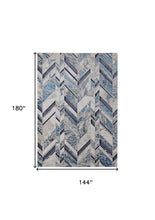 10' X 13' Ivory Blue And Gray Chevron Power Loom Distressed Area Rug