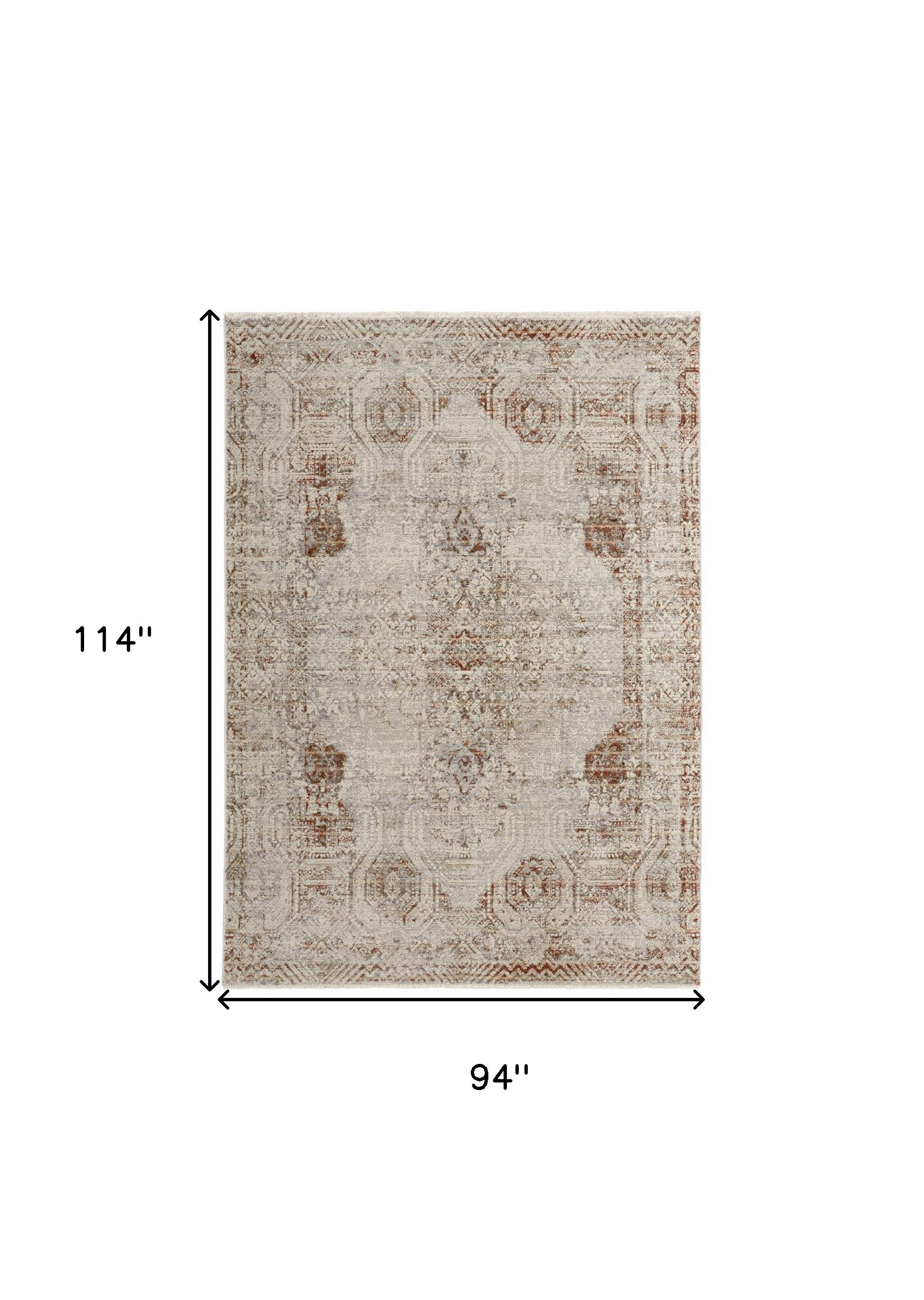 5' X 8' Tan Ivory And Orange Floral Power Loom Distressed Area Rug With Fringe