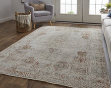 5' X 8' Tan Ivory And Orange Floral Power Loom Distressed Area Rug With Fringe