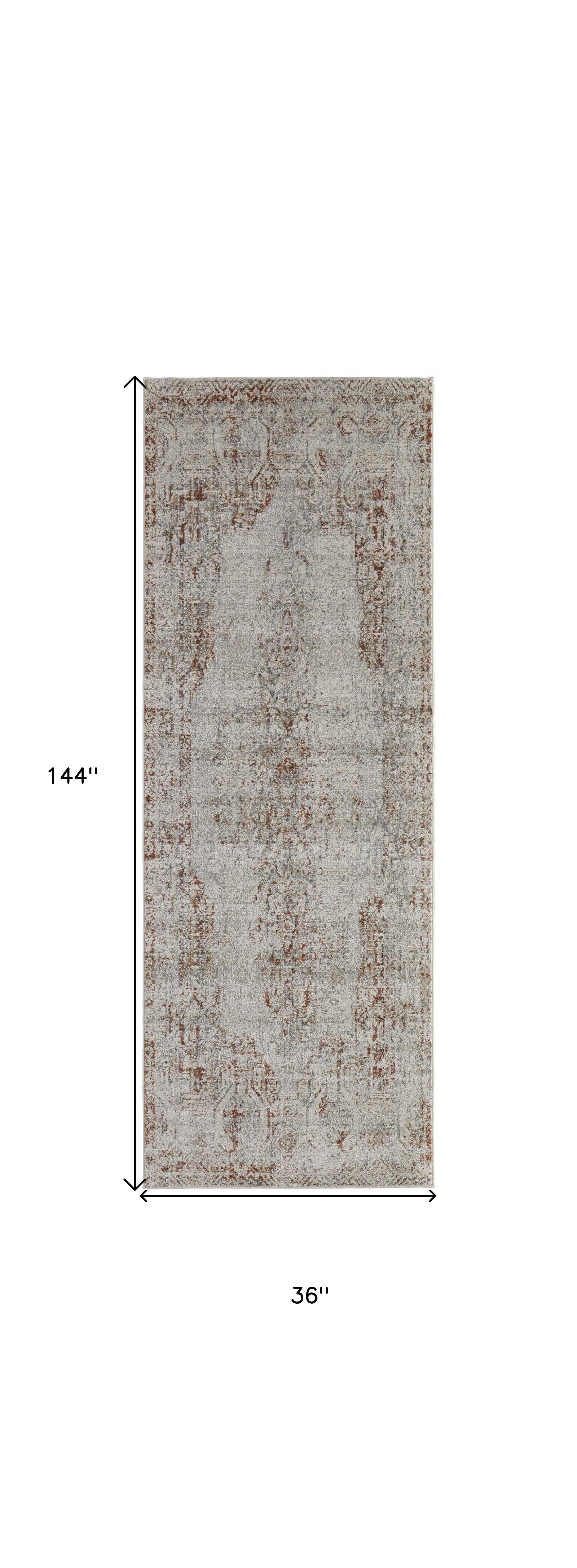 5' X 8' Tan Ivory And Orange Floral Power Loom Distressed Area Rug With Fringe