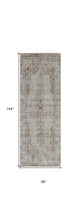 5' X 8' Tan Ivory And Orange Floral Power Loom Distressed Area Rug With Fringe