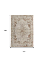 5' X 8' Tan Ivory And Orange Floral Power Loom Distressed Area Rug With Fringe