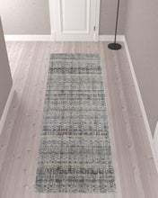 5' X 8' Tan Ivory And Blue Geometric Power Loom Distressed Area Rug With Fringe