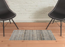 5' X 8' Tan Ivory And Blue Geometric Power Loom Distressed Area Rug With Fringe