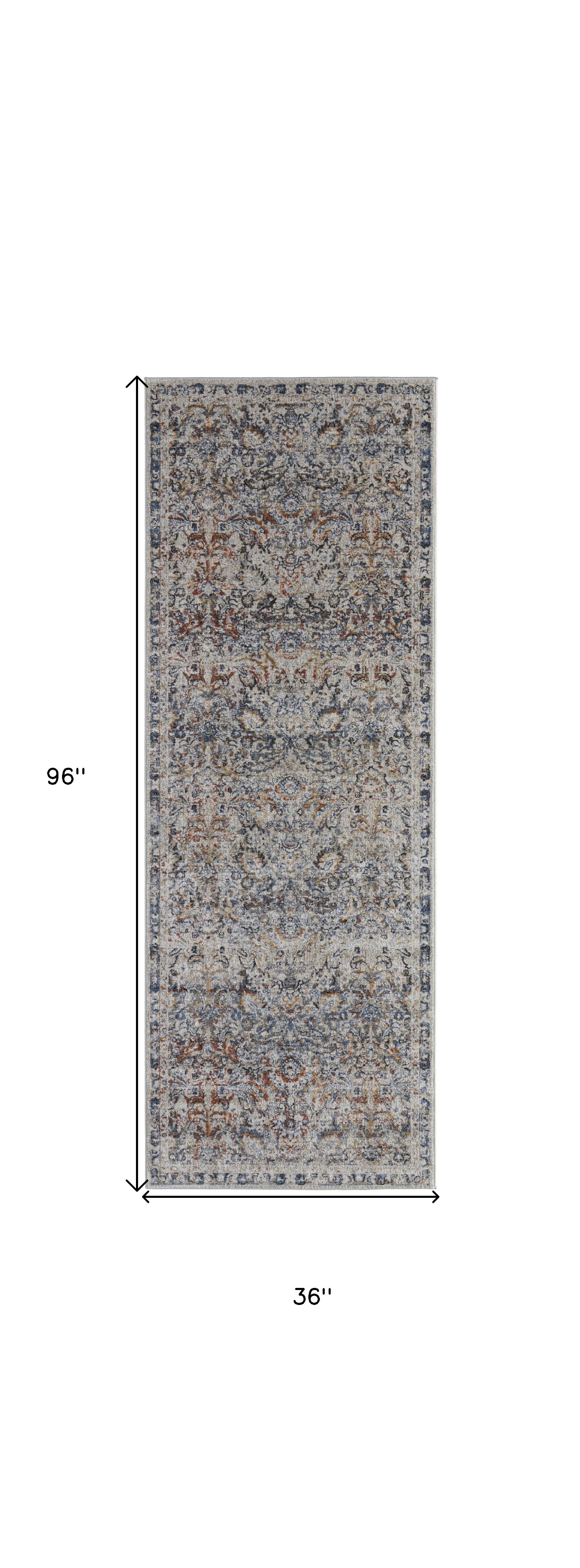 5' X 8' Tan Blue And Orange Floral Power Loom Distressed Area Rug With Fringe
