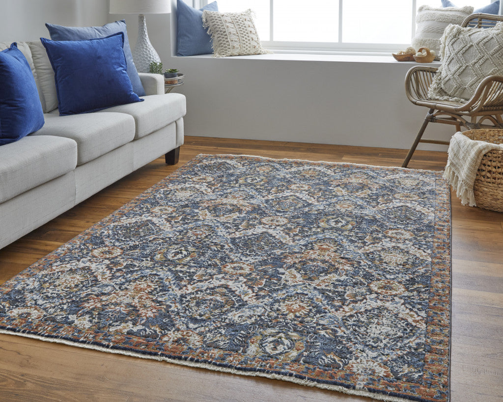 5' X 8' Blue Orange And Ivory Floral Power Loom Area Rug With Fringe