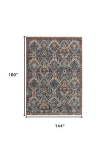 5' X 8' Blue Orange And Ivory Floral Power Loom Area Rug With Fringe