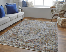 5' X 8' Tan Ivory And Orange Floral Power Loom Area Rug With Fringe