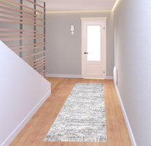 4' X 6' Ivory Tan And Taupe Abstract Stain Resistant Area Rug