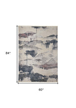5' X 7' Ivory Blue And Pink Abstract Stain Resistant Area Rug