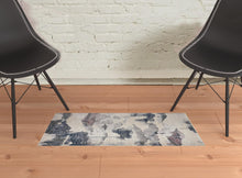 5' X 7' Ivory Blue And Pink Abstract Stain Resistant Area Rug
