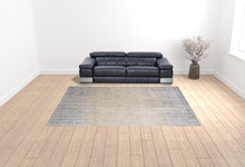 4' X 6' Tan Brown And Blue Abstract Power Loom Distressed Area Rug