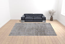 4' X 6' Taupe Silver And Tan Abstract Power Loom Area Rug