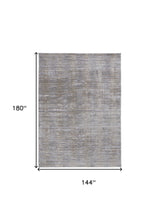 4' X 6' Taupe Silver And Tan Abstract Power Loom Area Rug
