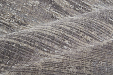 4' X 6' Tan Taupe And Gray Abstract Power Loom Distressed Stain Resistant Area Rug