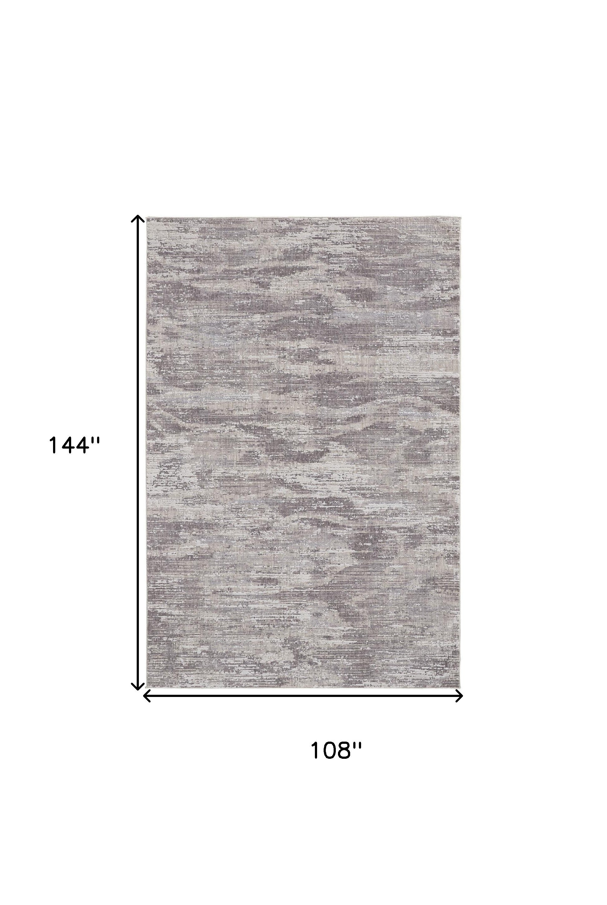 4' X 6' Tan Taupe And Gray Abstract Power Loom Distressed Stain Resistant Area Rug