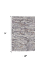4' X 6' Tan Taupe And Gray Abstract Power Loom Distressed Stain Resistant Area Rug