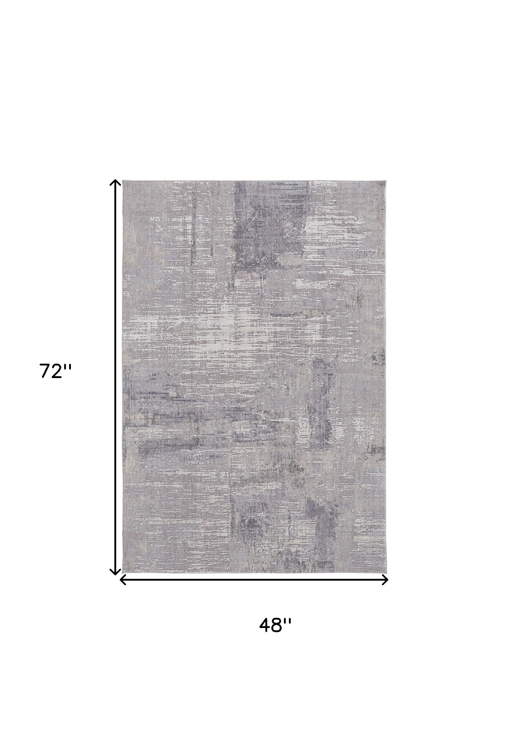 4' X 6' Taupe Tan And Blue Abstract Power Loom Distressed Stain Resistant Area Rug