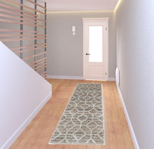 4' X 6' Tan Taupe And Ivory Geometric Power Loom Stain Resistant Area Rug