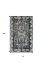 4' X 6' Ivory Tan And Blue Abstract Power Loom Distressed Stain Resistant Area Rug
