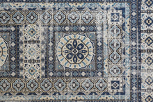 4' X 6' Ivory Tan And Blue Abstract Power Loom Distressed Stain Resistant Area Rug