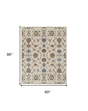 4' X 6' Ivory Blue And Tan Wool Floral Tufted Handmade Stain Resistant Area Rug