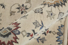 4' X 6' Ivory Blue And Tan Wool Floral Tufted Handmade Stain Resistant Area Rug