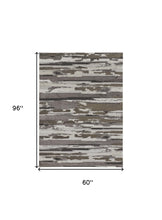 4' X 6' Brown And Ivory Abstract Power Loom Distressed Stain Resistant Area Rug