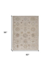 4' X 6' Tan And Brown Floral Hand Knotted Stain Resistant Area Rug