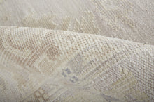 4' X 6' Tan Ivory And Orange Floral Hand Knotted Stain Resistant Area Rug