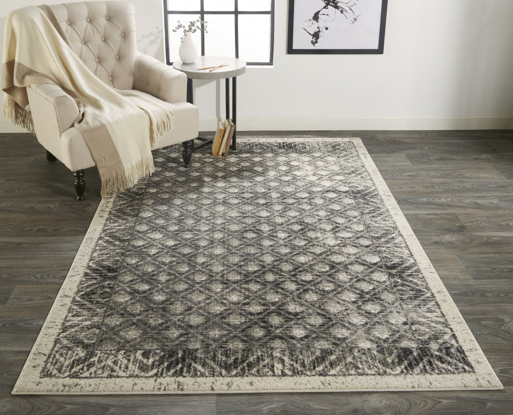 2' X 3' Ivory Black And Taupe Abstract Stain Resistant Area Rug