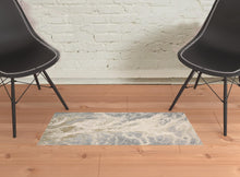 Ivory Silver And Gold Abstract Stain Resistant Area Rug - 2' x 3'