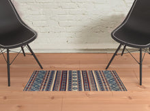 2' X 3' Blue Red And Ivory Geometric Power Loom Distressed Stain Resistant Area Rug