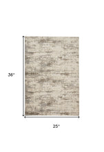 2' X 3' Ivory And Brown Abstract Area Rug