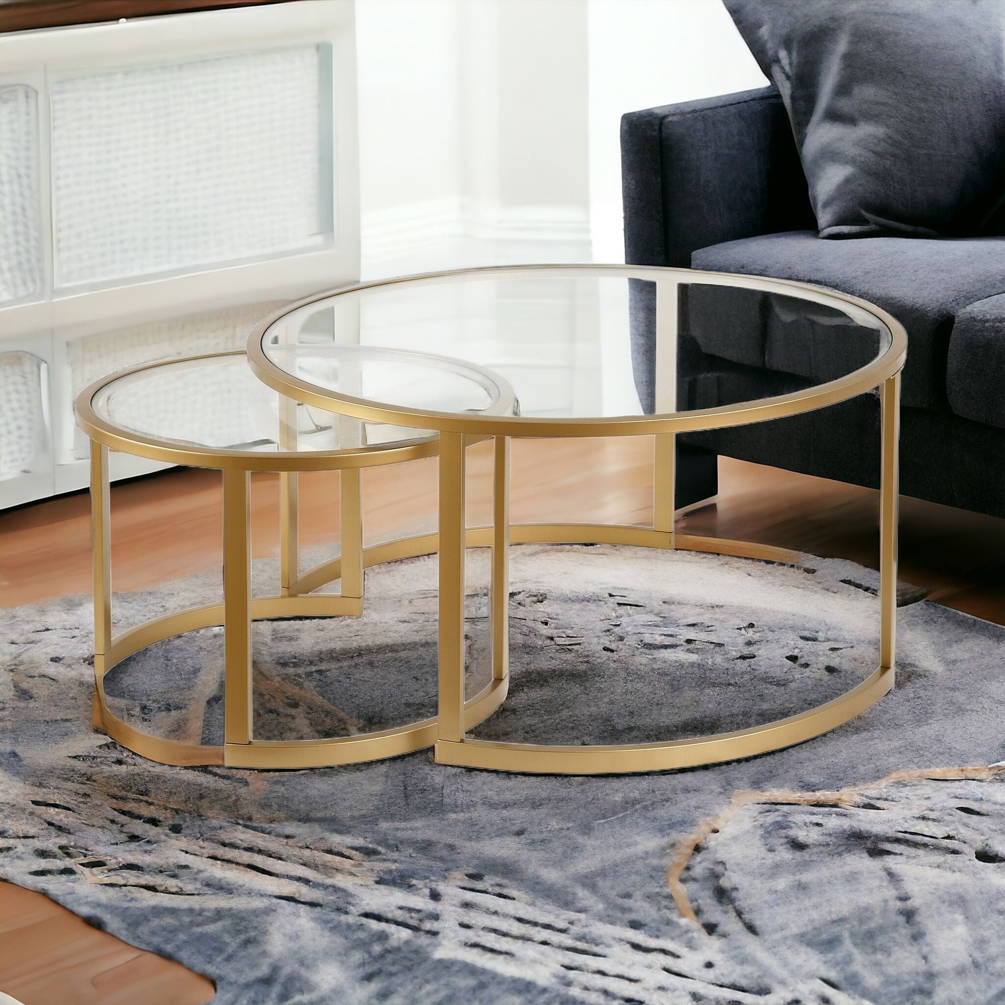 Set Of Two 36" Gold and Glass Round Nested Coffee Tables